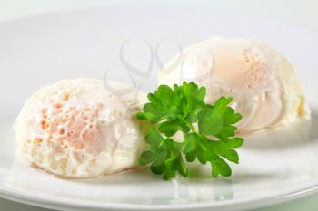 Two poached eggs on plate