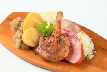 Roast duck and pork meat with three kinds of dumpling and white cabbage