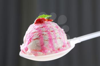 Scoop of berry ice cream on spoon
