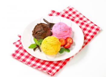 Three scoops of ice cream with different flavors