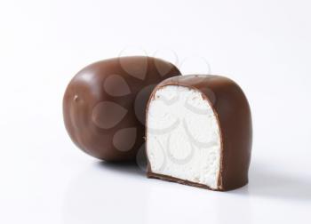 Marshmallows coated in milk chocolate