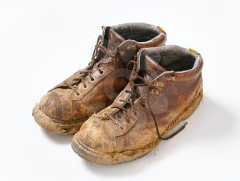 Pair of dirty brown walking boots 
