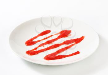 Strawberry drizzle sauce on plate