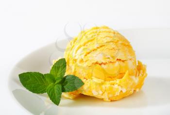 Scoop of pineapple or mango ice cream