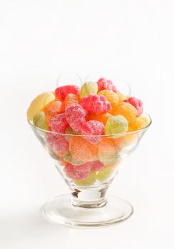 Fruit-shaped gummy candy coated in granulated sugar