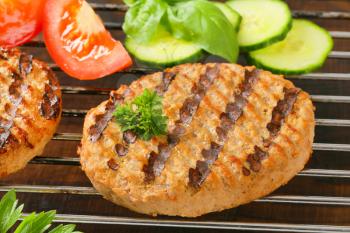Grilled patties on barbecue grid
