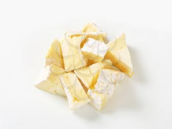 Pieces of French white rind cheese