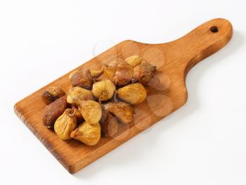 Dried figs on cutting board