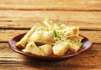 Artichoke hearts dressed in oil and herb marinade