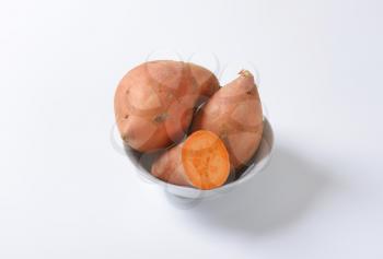 Sweet potatoes with orange flesh (rich source of vitamin A)
