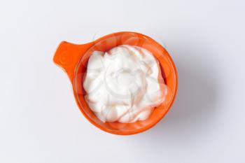creme fraiche in an orange bowl