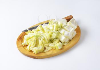 Chopped napa cabbage on cutting board
