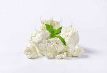 Pieces of curd cheese on white background