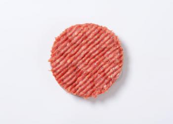raw hamburger patty on white background