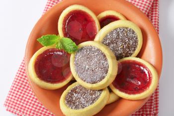 Mini tarts with jam and chocolate coconut filling