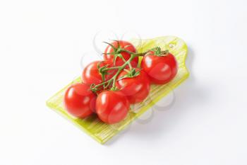 Fresh red tomatoes on wooden cutting board