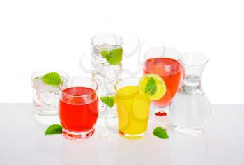 Glasses of fizzy water and fruit-flavored drinks