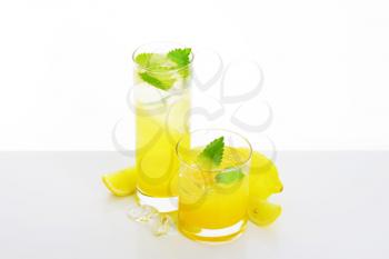 Glasses of fresh lemon juice drink with ice