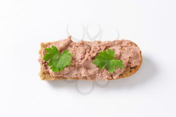 Baguette roll with pate on white background