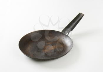 Rusty black skillet with one handle