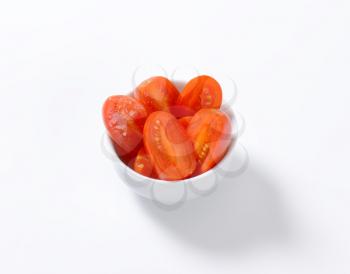 Bowl of halved fresh Roma tomatoes