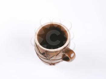 handcrafted pottery mug decorated with wire
