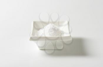 coarse ground salt in white rectangular bowl