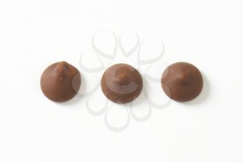 Chocolate chips on white background
