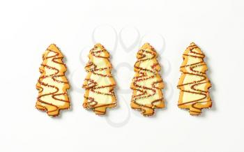 Christmas tree shaped cookies decorated with icing and sprinkles