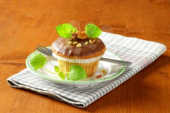 Nut muffin with chocolate glaze