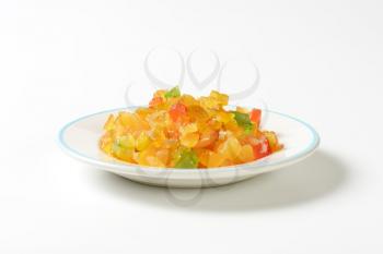 plate of candied fruit on white background