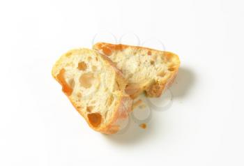 Ciabatta bread slices on white background