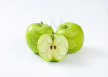 Two whole and half a green apple