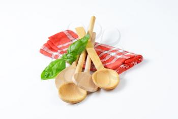 wooden spoons on red checkered dish towel
