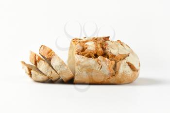 loaf of fresh crusty bread, three slices cut off