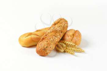 freshly baked bread rolls on white background