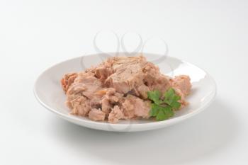 chunks of canned tuna on white plate
