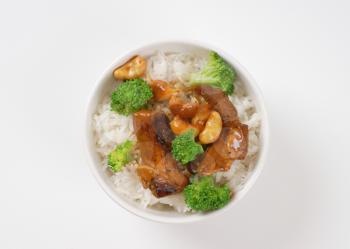 Stir-fried beef with cashews and broccoli served with rice