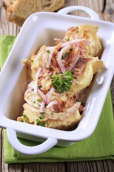 Potato salad with strips of ham and cream sauce