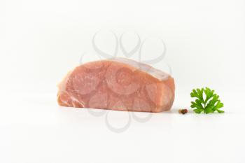 Piece of fresh pork loin on white background