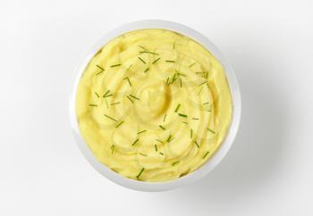 bowl of potato puree with chopped chives