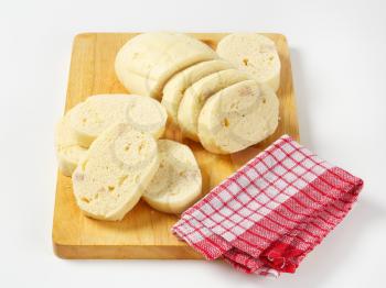 Side dish - Raised white bread dumplings on cutting board