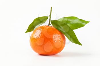 tangerine with leaves on white background