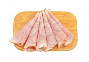 thin ham slices on wooden cutting board