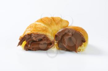 croissants with chocolate cream on white background