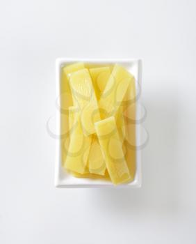 bowl of bamboo shoot slices on white background