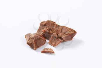pieces of milk chocolate on white background