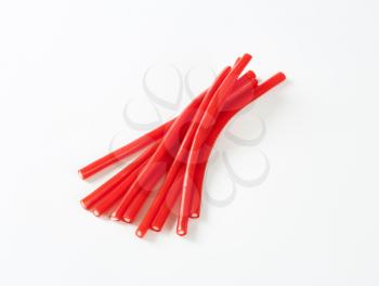 Soft and chewy strawberry or cherry flavoured candy sticks with a fondant centre