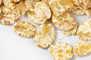 detail of oat flakes on white background