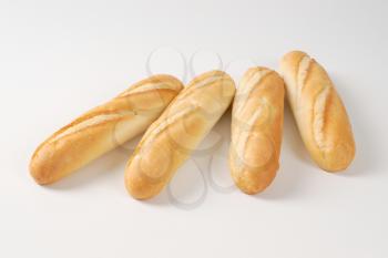 small french baguettes on white background
